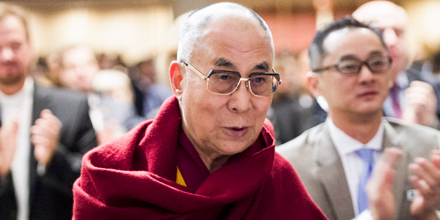 The Dalai Lama attends the National Prayer Breakfast in Washington, DC, February 5, 2015. AFP PHOTO / SAUL LOEB        (Photo credit should read SAUL LOEB/AFP/Getty Images)